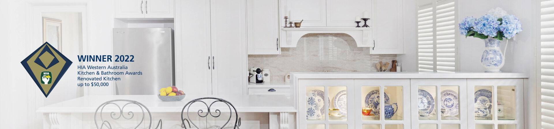 Flexi Renovations Perth Award-winning white traditional kitchen renovation featuring glass-front cabinetry, blue china display, and elegant bar stools
