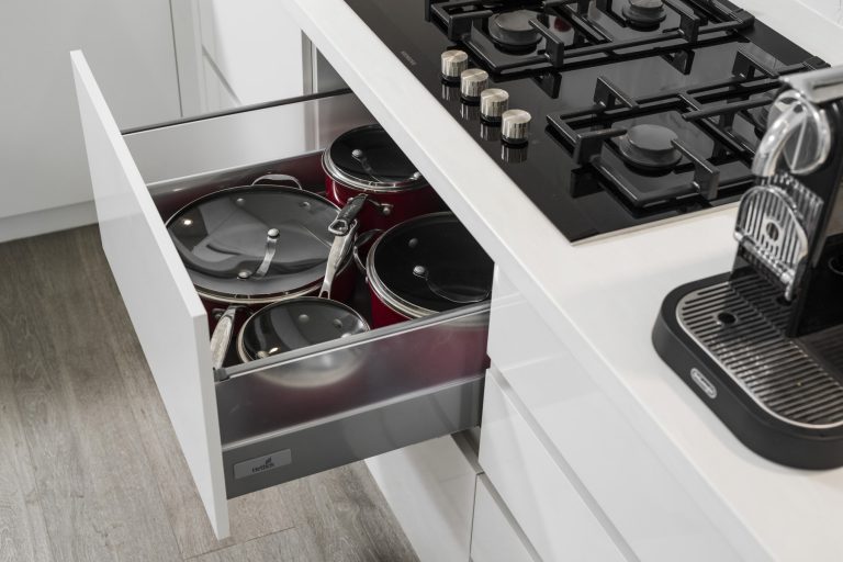 Modern Subiaco kitchen renovation with open drawer, showcasing efficient storage for pots and pans. Perth, Western Australia carpentry.
