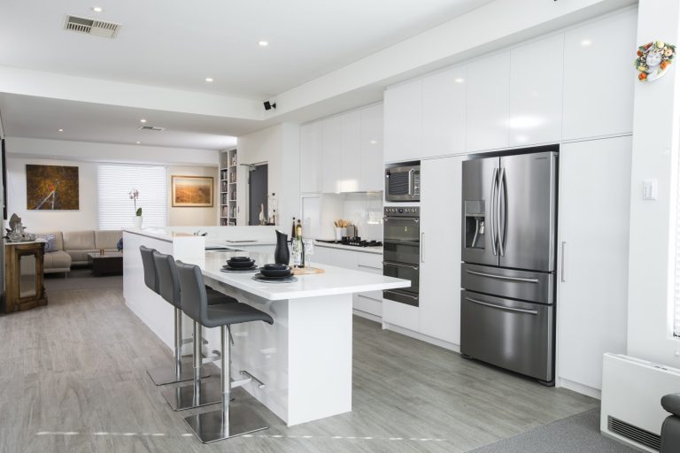 Modern kitchen design in Subiaco, Perth. A29V5179 shows white cabinetry, island, and stainless steel appliances in a renovated home.