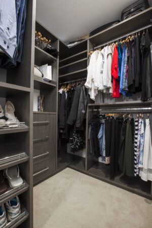 Rivervale minimalist luxury: Custom closet design with shelving, drawers, and hanging racks for organized storage.