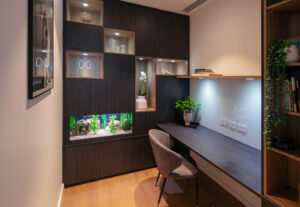Modern Floreat study with custom cabinetry, aquarium, workspace, and display niches, showcasing boutique design.