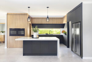 Scandi Minimal kitchen in Ocean Reef featuring a central island, sleek cabinetry, and modern pendant lighting.