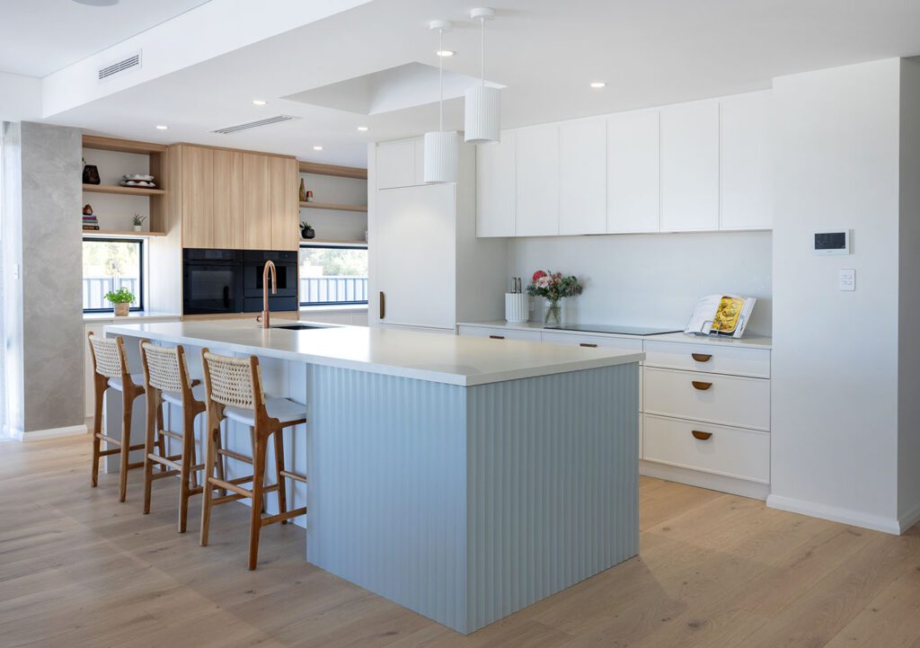 Flexi Design Journey: Modern kitchen with island, white cabinets, wood accents, and stylish bar stools.